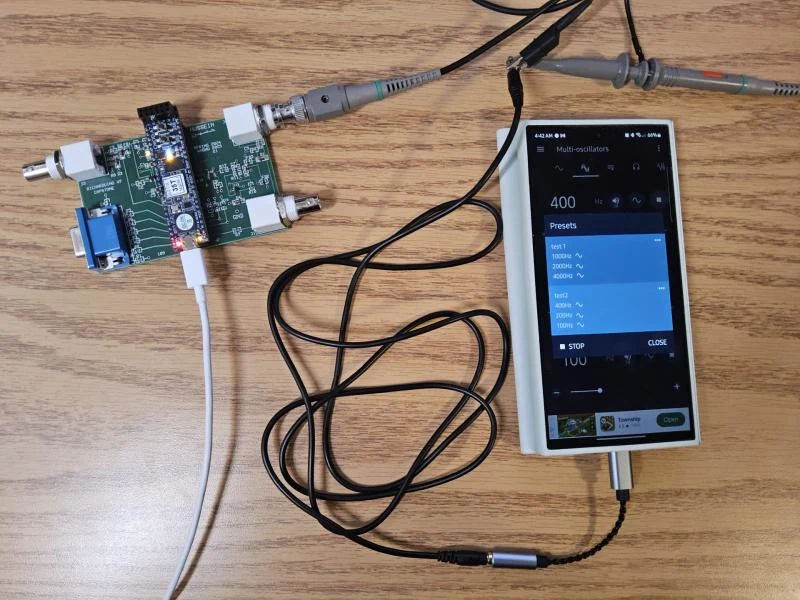 The original RichArduino oscilloscope hardware connected to a phone signal source on a wooden workbench